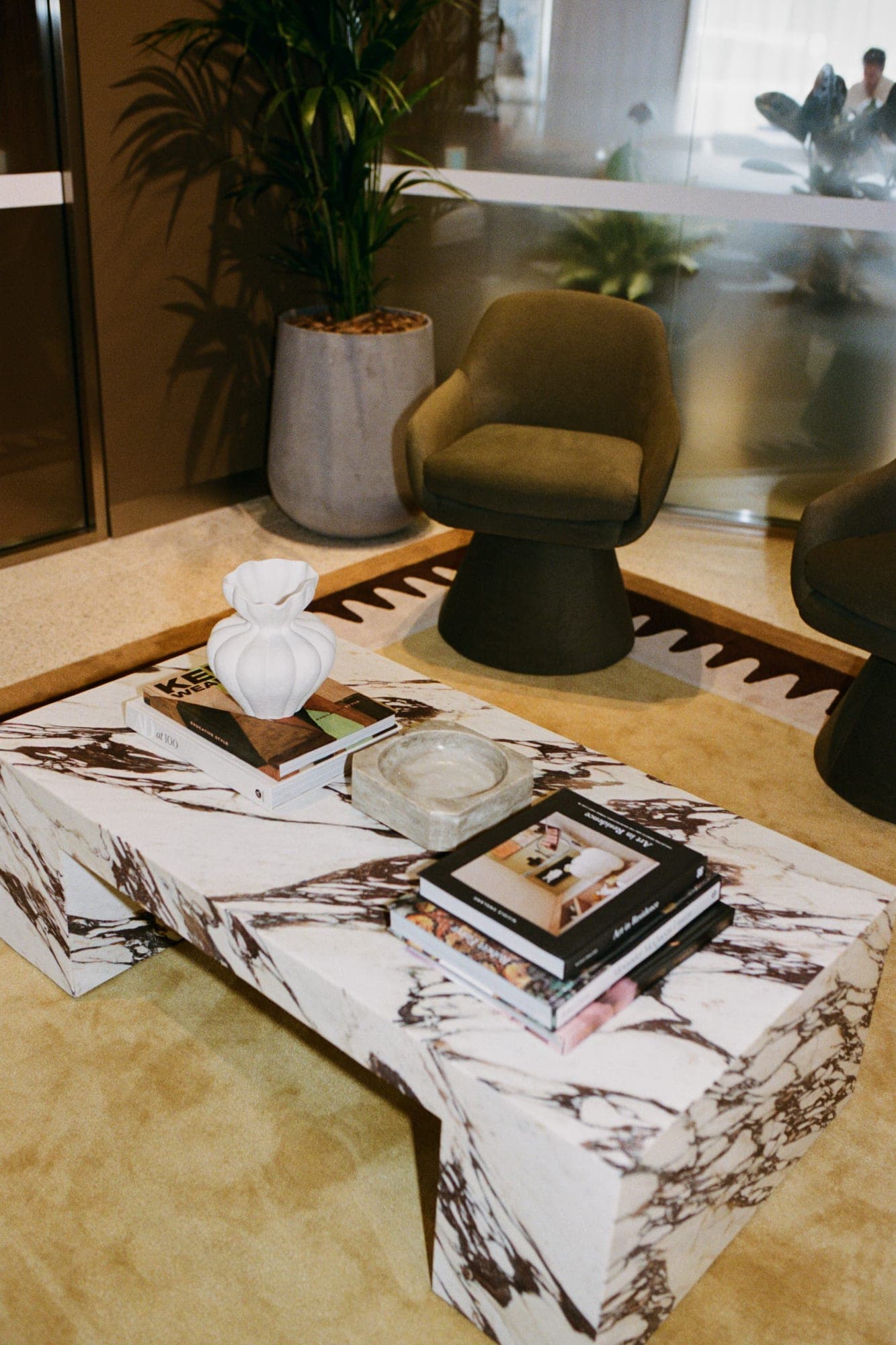 A marble table with design books at our space